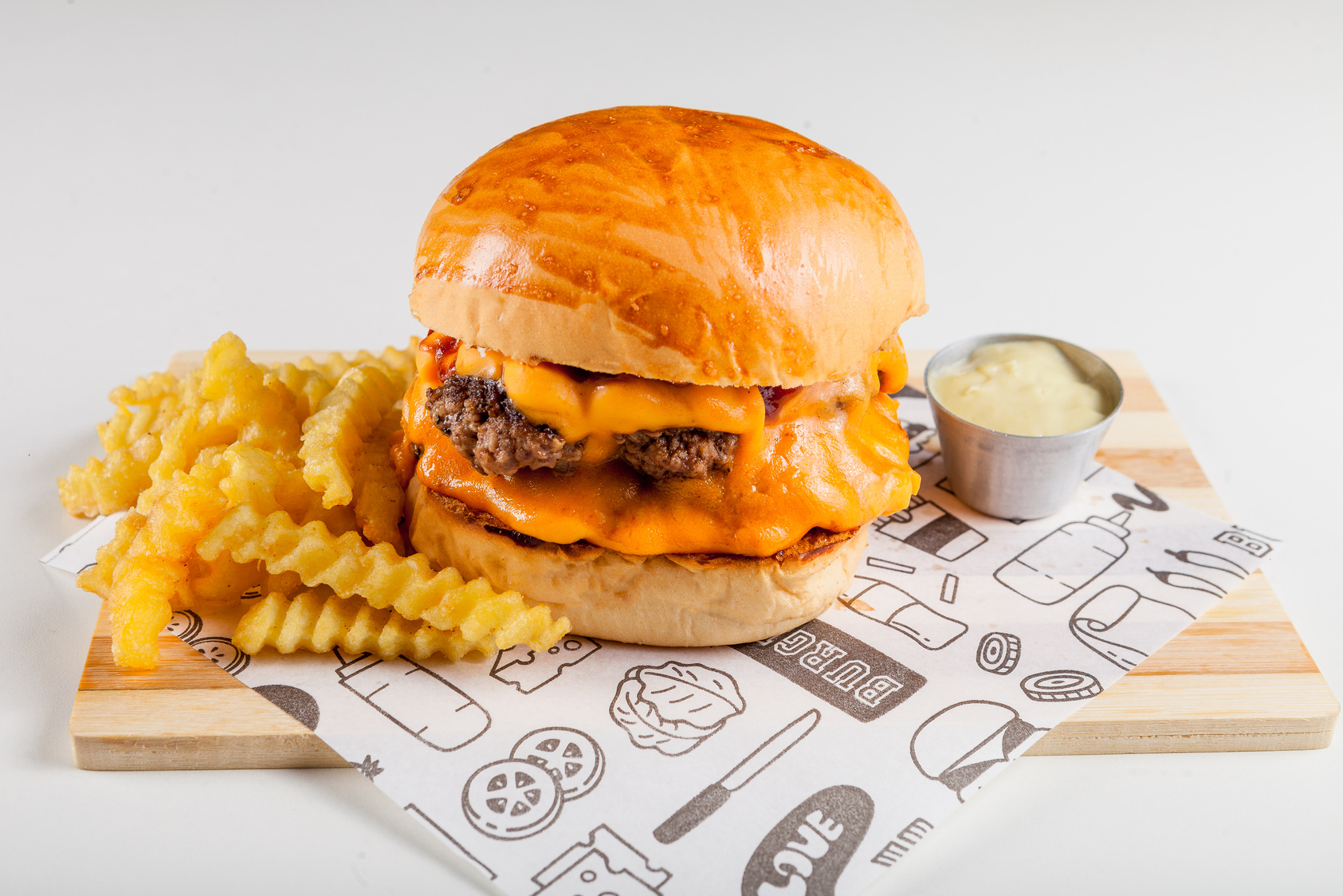 Burger With Cheese and Fries on White Paper