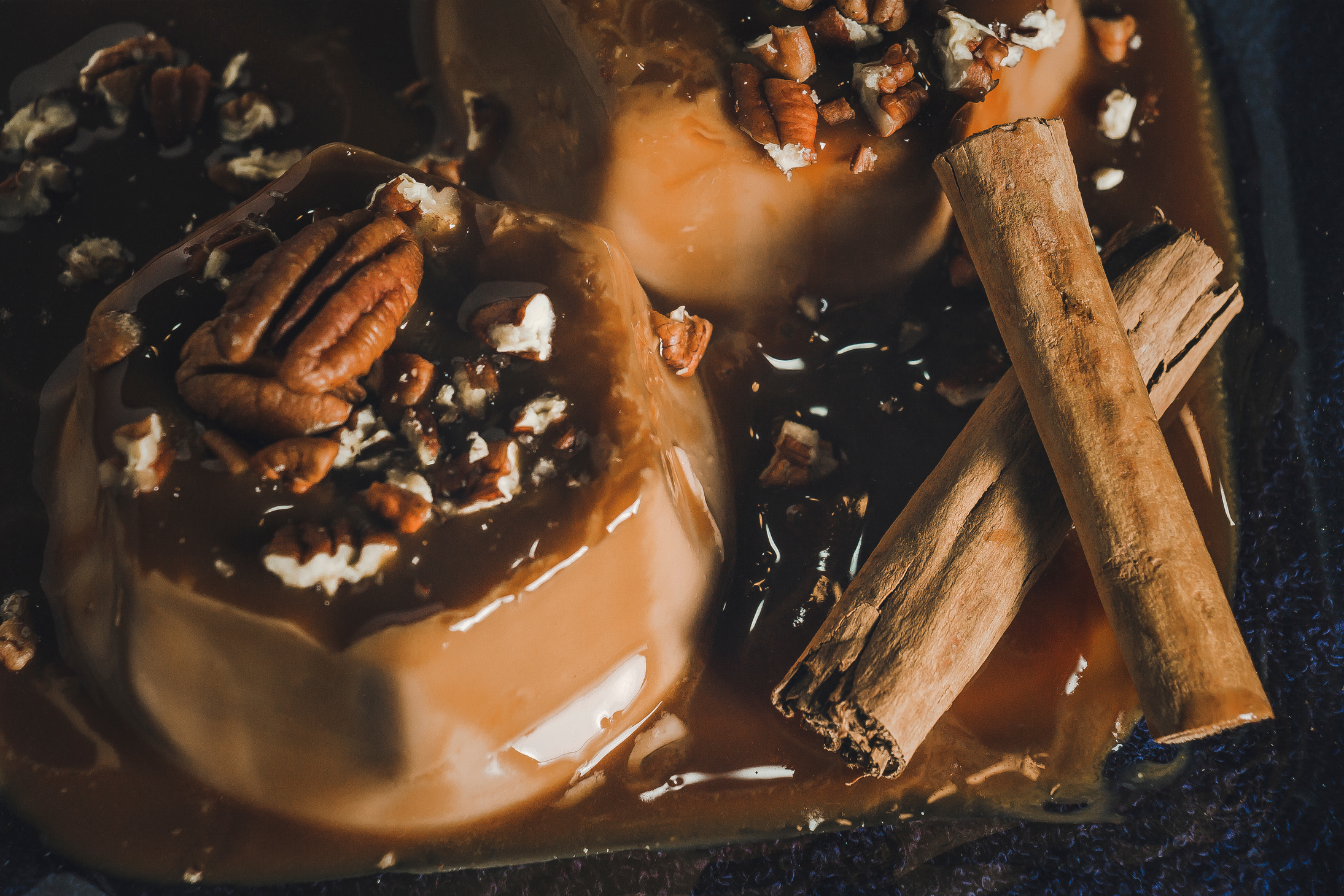 Flans with Pecans and Cinnamon Sticks Close-up